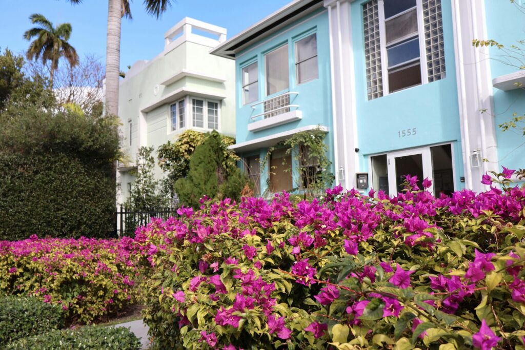 pexels photo 30224020 30224020 Art Deco architecture with vibrant bougainvillea in a sunny garden setting.